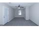 Spacious bedroom with ceiling fan, window, and direct access to the outside at 321 Summerwood Ln, Stockbridge, GA 30281