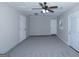 Bright and airy bedroom featuring two exterior doors and a ceiling fan at 321 Summerwood Ln, Stockbridge, GA 30281