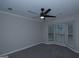 Comfortable bedroom with bay window and ceiling fan, offering a peaceful retreat at 321 Summerwood Ln, Stockbridge, GA 30281
