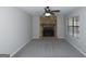 Spacious living room with a striking stone fireplace, ceiling fan and large, bright window at 321 Summerwood Ln, Stockbridge, GA 30281