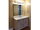Bathroom featuring a modern vanity with marble countertop and updated fixtures at 5734 Wellborn Oaks Ct, Lithonia, GA 30058