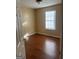 Neutral bedroom with hardwood floors and natural light, a cozy haven for rest and relaxation at 5734 Wellborn Oaks Ct, Lithonia, GA 30058