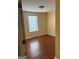 Cozy bedroom with hardwood floors and a window, perfect for relaxation and comfort at 5734 Wellborn Oaks Ct, Lithonia, GA 30058
