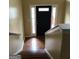 Inviting foyer with wood flooring and staircase leading to the upper level at 5734 Wellborn Oaks Ct, Lithonia, GA 30058