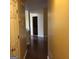 Inviting hallway featuring hardwood floors and neutral paint, leading into other rooms of the home at 5734 Wellborn Oaks Ct, Lithonia, GA 30058