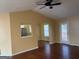 Well-lit living room with vaulted ceilings, wood floors, and an open layout at 5734 Wellborn Oaks Ct, Lithonia, GA 30058