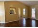 Bright living room with vaulted ceiling, hardwood floors, and access to outdoor deck at 5734 Wellborn Oaks Ct, Lithonia, GA 30058