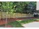Backyard featuring a wooden fence and a grassy area, offering privacy and space for outdoor activities at 1188 Oakland Sw Ln, Atlanta, GA 30310