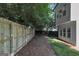 Private backyard featuring a wooden fence, providing a secure and serene outdoor space to relax or play at 1188 Oakland Sw Ln, Atlanta, GA 30310
