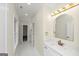 Hall bathroom featuring a sink and views to the doorways to the bedroom at 1188 Oakland Sw Ln, Atlanta, GA 30310