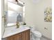 Modern bathroom with wood vanity, white quartz countertop, and hexagon tile floor at 1188 Oakland Sw Ln, Atlanta, GA 30310