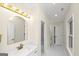 Bright bathroom with white marble floors and bronze fixtures at 1188 Oakland Sw Ln, Atlanta, GA 30310