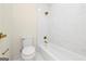 Bright bathroom with a white marbled shower and white fixtures at 1188 Oakland Sw Ln, Atlanta, GA 30310