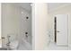 Bright bathroom featuring marble floors, a toilet, and a bathtub with bronze fixtures at 1188 Oakland Sw Ln, Atlanta, GA 30310