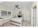 Bright bedroom with a ceiling fan and a window with blinds overlooking the outside at 1188 Oakland Sw Ln, Atlanta, GA 30310