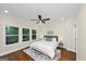 Bedroom with hardwood flooring, ceiling fan, and large windows at 1188 Oakland Sw Ln, Atlanta, GA 30310