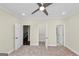 Bright bedroom with carpet flooring, ceiling fan, and closet access at 1188 Oakland Sw Ln, Atlanta, GA 30310