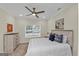 Bright bedroom with a ceiling fan and a window with blinds overlooking the outside at 1188 Oakland Sw Ln, Atlanta, GA 30310