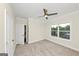 Neutral bedroom with plush carpet, window, and a ceiling fan at 1188 Oakland Sw Ln, Atlanta, GA 30310