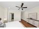 Bedroom with hardwood floors, ceiling fan, dresser, and closet access at 1188 Oakland Sw Ln, Atlanta, GA 30310