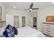 Stylish bedroom with a ceiling fan, ensuite bath, and walk-in closet access at 1188 Oakland Sw Ln, Atlanta, GA 30310