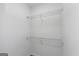 Walk-in closet featuring shelving for optimal organization and storage at 1188 Oakland Sw Ln, Atlanta, GA 30310