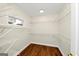 Spacious walk-in closet featuring ample storage space with shelving to keep belongings organized at 1188 Oakland Sw Ln, Atlanta, GA 30310