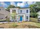 Attractive two-story home with white and brick exterior, complemented by a lush green lawn, creating curb appeal at 1188 Oakland Sw Ln, Atlanta, GA 30310