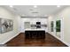 Spacious kitchen featuring a center island, bar stools, and stainless steel appliances at 1188 Oakland Sw Ln, Atlanta, GA 30310