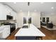 Bright, eat-in kitchen with expansive countertop, modern appliances, and an adjacent living area at 1188 Oakland Sw Ln, Atlanta, GA 30310