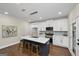 Charming kitchen boasts stainless steel appliances, white cabinets, and a contrasting dark island at 1188 Oakland Sw Ln, Atlanta, GA 30310