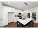 Stylish kitchen features an island with white countertop, modern lighting, and stainless steel appliances at 1188 Oakland Sw Ln, Atlanta, GA 30310
