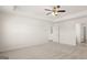 Large primary bedroom with ceiling fan and carpet at 600 Whitman Ln # 2026, Stockbridge, GA 30281