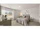 Cozy bedroom with a plush bed, neutral decor, and a large window with a view at 600 Whitman Ln # 2026, Stockbridge, GA 30281