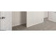 Spacious bedroom featuring multiple doorways and neutral carpet throughout the interior of the home at 600 Whitman Ln # 2026, Stockbridge, GA 30281