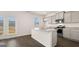 Modern kitchen featuring gray cabinets, granite countertops, stainless steel appliances, and a kitchen island at 600 Whitman Ln # 2026, Stockbridge, GA 30281
