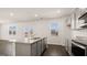 Open kitchen with a granite counter island, stainless steel appliances, and plenty of natural light at 600 Whitman Ln # 2026, Stockbridge, GA 30281