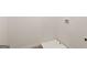 A white tiled laundry room with electric hook ups and fresh paint throughout the interior at 600 Whitman Ln # 2026, Stockbridge, GA 30281