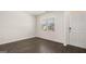 Cozy living room with dark flooring and a large window for natural light at 600 Whitman Ln # 2026, Stockbridge, GA 30281