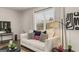 Bright living room with contemporary decor, comfortable seating, and natural light from a large window at 600 Whitman Ln # 2026, Stockbridge, GA 30281