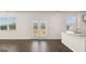 Bright living space featuring hardwood floors, large windows and doors to outdoor deck at 600 Whitman Ln # 2026, Stockbridge, GA 30281
