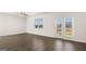 Spacious living room with hardwood floors, ceiling fan and access to the outside deck at 600 Whitman Ln # 2026, Stockbridge, GA 30281