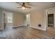 Bedroom featuring modern wood floors, neutral walls and a door into a bathroom at 5122 Hillcrest Nw Dr, Covington, GA 30014
