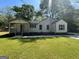 Charming single-story home with a covered porch and well-manicured lawn at 5122 Hillcrest Nw Dr, Covington, GA 30014