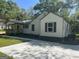 A charming single-story house with neutral siding and dark shutters at 5122 Hillcrest Nw Dr, Covington, GA 30014