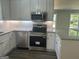 Modern kitchen with stainless steel appliances and granite countertops at 5122 Hillcrest Nw Dr, Covington, GA 30014