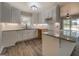 Modern kitchen with white cabinets, granite countertops, and stainless steel sink at 5122 Hillcrest Nw Dr, Covington, GA 30014