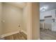 A laundry hookup featuring modern wood floors, base trim and neutral walls with electrical and drain access at 5122 Hillcrest Nw Dr, Covington, GA 30014