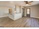 Bright, open-concept layout with gray cabinets and countertops and modern flooring at 5122 Hillcrest Nw Dr, Covington, GA 30014