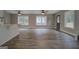 Bright living room featuring modern wood floors, neutral walls, a front door and windows with natural light at 5122 Hillcrest Nw Dr, Covington, GA 30014